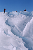 Tourist on Wind sculpted snow in a scoop at the side of the Ekstrom Ice Shelf. Weddell Sea. Antarctica.
