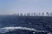 The Ekstrom Ice shelf stretches into the distance, with a band of bergy bits. Weddell Sea. Antarctica.