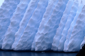 Ridges and dimples on an iceberg. Antarctica