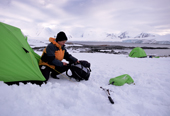 Adventure tourism, camping in Antarctica, taking down the tent at Weincke Island