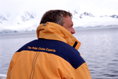 Passenger on a Quark expedition trip in the smart yellow jacket with slogan on the shoulders