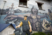 Postman figure and dramatic mural on the Post Office in Ushuaia. Argentina.