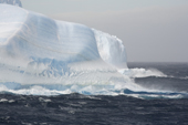 Waves break agains the bottom of large icebergs on a stormy day in Erebus & Terror Gulf. Antarctic Peninsula