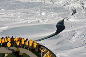 Passengers on the bows of the Kapitan Khlebnikov watch the ship break ice. Weddell Sea. Antarctica