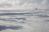 Russian Mi2 helicopter flies over the ice dome of Snow Hill Island. Weddell Sea Antarctica.