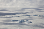 The ice dome of Snow Hill Island with small icebergs frozen in the sea ice. Weddell Sea Antarctica.