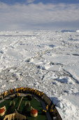 Yellow jacketed tourists on the bow of the Kapitan Khlebnikov in pack ice in Erebus & Terror Gulf. Antarctica