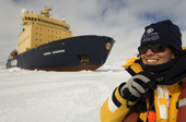 Tour Biologist Jaclyn McPhadden on the radio as the Kapitan Khlebnikov parks in the ice. Antarctica