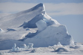 Small well weathered iceberg frozen into the sea ice at Snow Hill Island. Antarctica