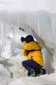 Photographing icicles hanging off the ice on Snow Hill Island. Antarctica