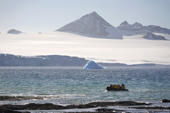 Tourists in a Zodiac, with a backdrop of the glaciers on the Tabarin Peninsula. Antarctica.
