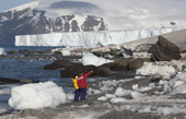 Tour geologist Jason points out the the highlights at Brown Bluff with a backdrop of Glaciers. Antarctica