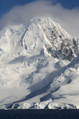Cloud topped Mountain and katabatic winds in the lower glaciers. The Gerlache Strait. Antarctic Peninsular