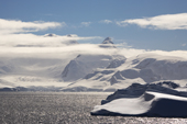 Mountains and bands of cloud and high wind in the Gerlache Strait. Antarctic Peninsular