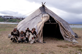 Chukchi family stand by their Uranga, canvas tent. Yanrakynnot. Chukotka. Siberia. 1997