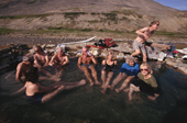 Tourists relaxing in the Senyarinskiya Hot Springs in a river valley. Chukotka. Siberia. Russia. 1997