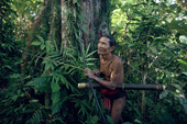 Bow & arrow at the ready Aman Baoi stalks a monkey. Siberut Island. Indonesia.