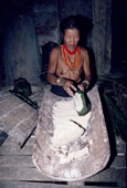A Mentawai woman prepares sago in the longhouse. Siberut Is. Indonesia.
