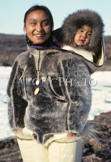 Inuit mother carries her child in her sealskin Amaut. Qeqertat. N.W ...
