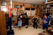 Tony Weyiouanna's boys play basketball in the house in the evening. Shishmaref. Seward Peninsula. Alaska. 2003