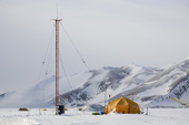 The Radio tent and mast at Patriot Hills camp, with a backdrop of Patriot Hills. Antarctica