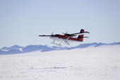 Twin Otter on ski's, from Borek takes off at Patriot Hills, it uses a snow skiway. Antarctica