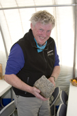 Ian Dalziel, Geologist, holds a lump of Haag Nunatak Gneiss, 2 Billion years old. Patriot Hills. Antarctica