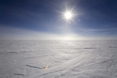 Sun shining over the Polar Plateau at 89 degrees South. Antarctica.