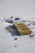 Aerial view of the Amundsen-Scott Station, showing both the Dome being dismantled and the new building. South Pole, Antarctica. January 2006
