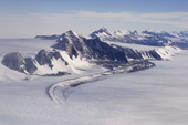 Aerial view of the Independence Hills, along a curved moraine to the Morris Ice Cliffs. Ellsworth Mountains. West Antarctica