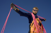 Norwegian mountaineer prepares the ropes for his climb at Mount Vinson Base Camp. Vinson Massif, Antarctica