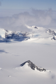 Cloud hides the mountains of the Heritage Range, but an isolated peak is cloud free. Ellsworth Mountains. West Antarctica