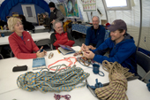 Field Guide, Andy Tyson teaches Crevasse Rescue to a group of visitors to Patriot Hills. Antarctica