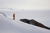 Walking on a snow slope in the Patriot Hills with a view over the Polar Plateau. Antarctica