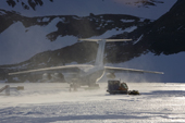 Snow blows around the Camoplast as the Ilyushin 76TD taxis to the Blue Ice Runway at Patriot Hills to take off. Antarctica
