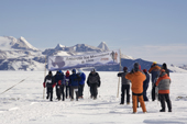 The Runners competing in the 2006 Antarctic Ice Marathon pass the Start banner. Patriot Hills. Antarctica.