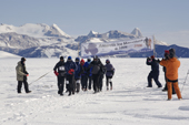 The Runners competing in the 2006 Antarctic Ice Marathon pass the Start banner. Patriot Hills. Antarctica.