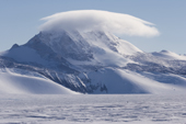 Mount Fordell, 1670m high with a cap of Orographic cloud. Independence Hills. Antarctica