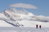 Visitors to Patriot Hills enjoy the Antarctic skiing experience with Mt Fordell in the background. Antarctica