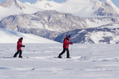 Visitors to Patriot Hills enjoy the Antarctic skiing experience with the Independence Hills in the background. Antarctica