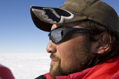 Profile Portrait of Pato wearing his wolf hat and shades in Antarctica.