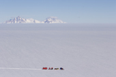 The Chilean Traverse, pulled by the Camoplast, to survey the Ellsworth under ice Lake with the Pirit Hills on the horizon. Antarctica