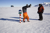 Celebratory hand walk around the Ceremonial South Pole. Antarctica