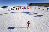 The Ceremonial South Pole and Flags of Nations. Amundsen-Scott Station new building. Antarctica