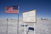 The Stars & Stripes at the Geographic South Pole, and line of previous Poles. Antarctica