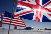 Union Jack and the Stars & Stripes fly with the Flags of Nations at the Ceremonial South Pole & the Dome. Antarctica
