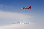 Twin Otter flies over the Polar Plateau, close to the Pirit Hills. Antarctica