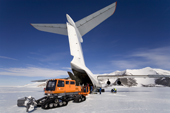 Unloading the Ilyushin 76TD with a Tucker-terra and sled on the Blue Ice Runway at Patriot Hills. Antarctica