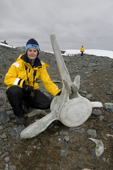 Sanne from the Netherlands with a whale vertebra at Mikkelsen Harbour, Trinity Island. Antarctica