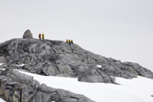 Tourists by the Cairn at Port Charcot, Booth Island. Antarctica